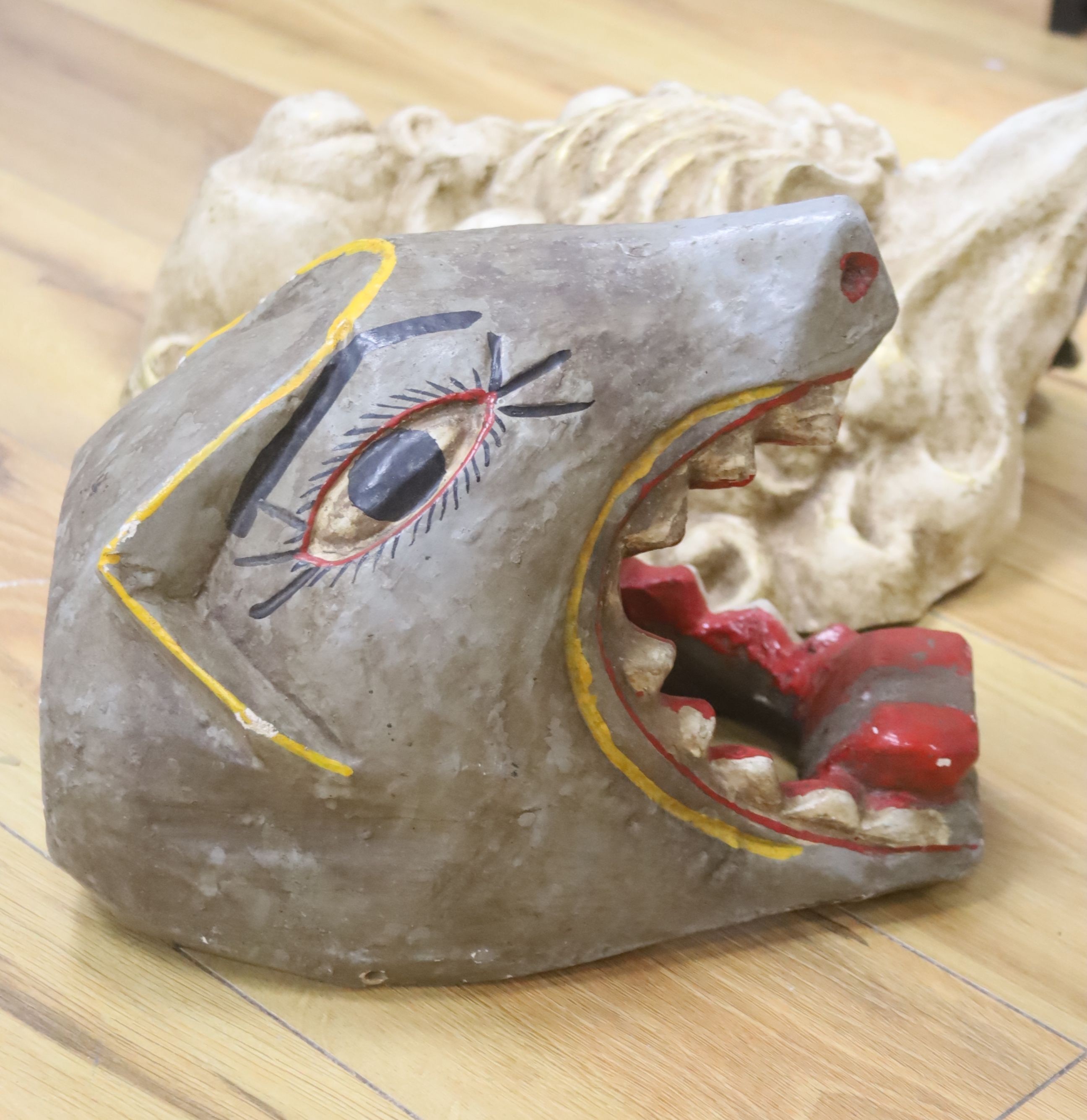 A Venetian gilded papier mache grotesque mask, 46cm, and a painted wood wild animal mask, 13cm